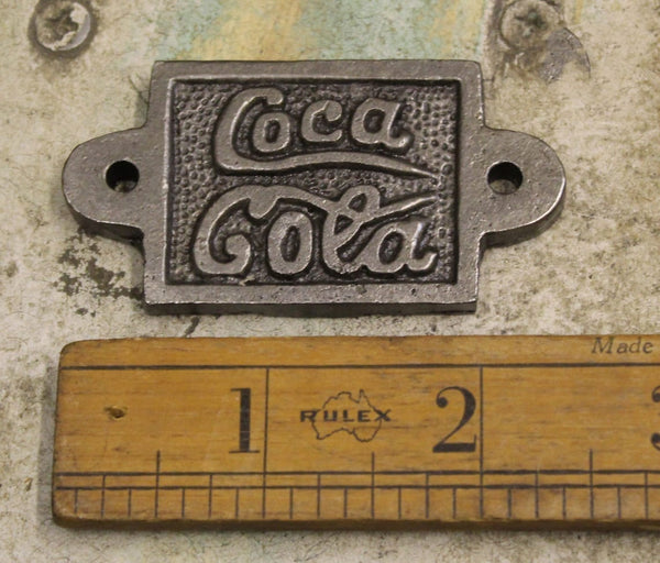 Plaque COKE Fits Cap Catcher Cast Antique Iron